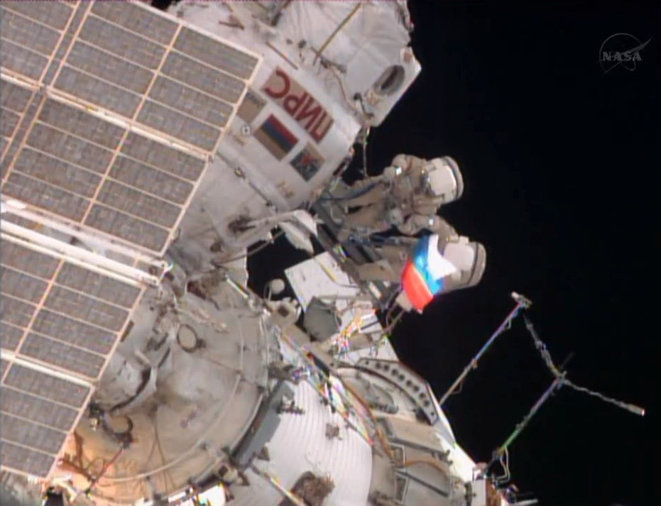Spacewalking Cosmonauts Wave Russia's Flag in Orbit, Tackle Faulty Gear